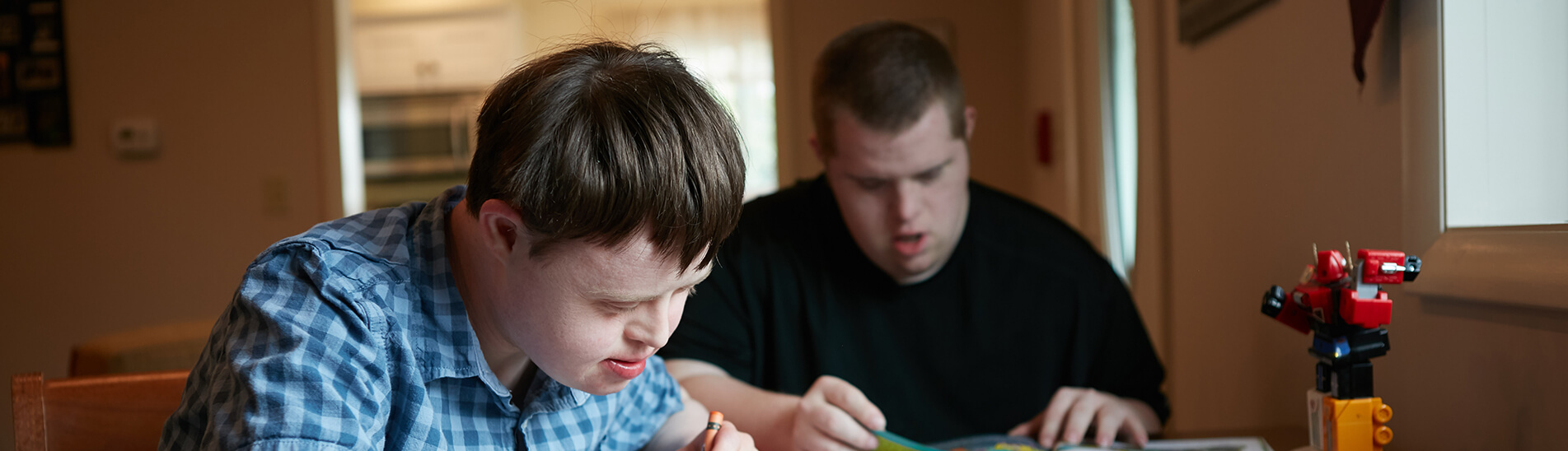 Two young students immersed in the Pathfinder Village education.